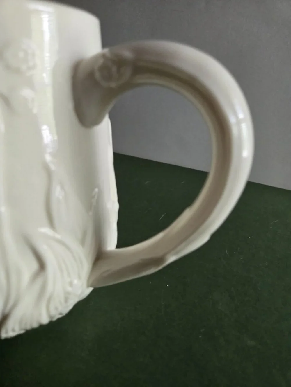 Pair of Ivory Bisque Pitchers